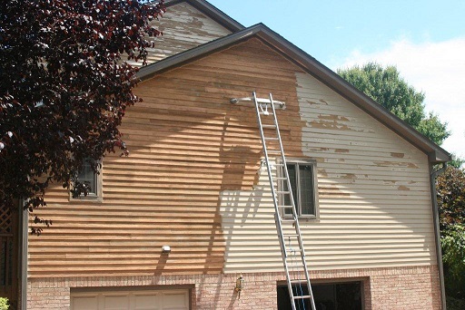 House with partial paint stripping