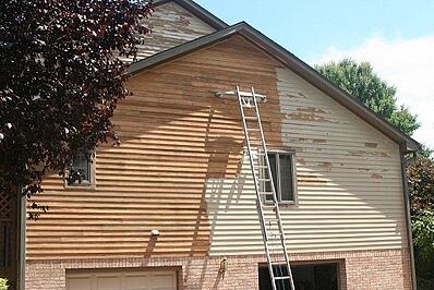 House with partial paint stripping
