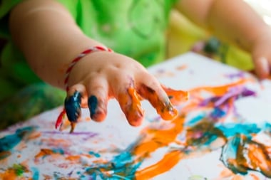 Image of finger painting a properly painted surface by painting contractors